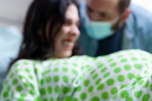 Close up of woman holding bedsheet with hand Close up of woman holding bedsheet with hand